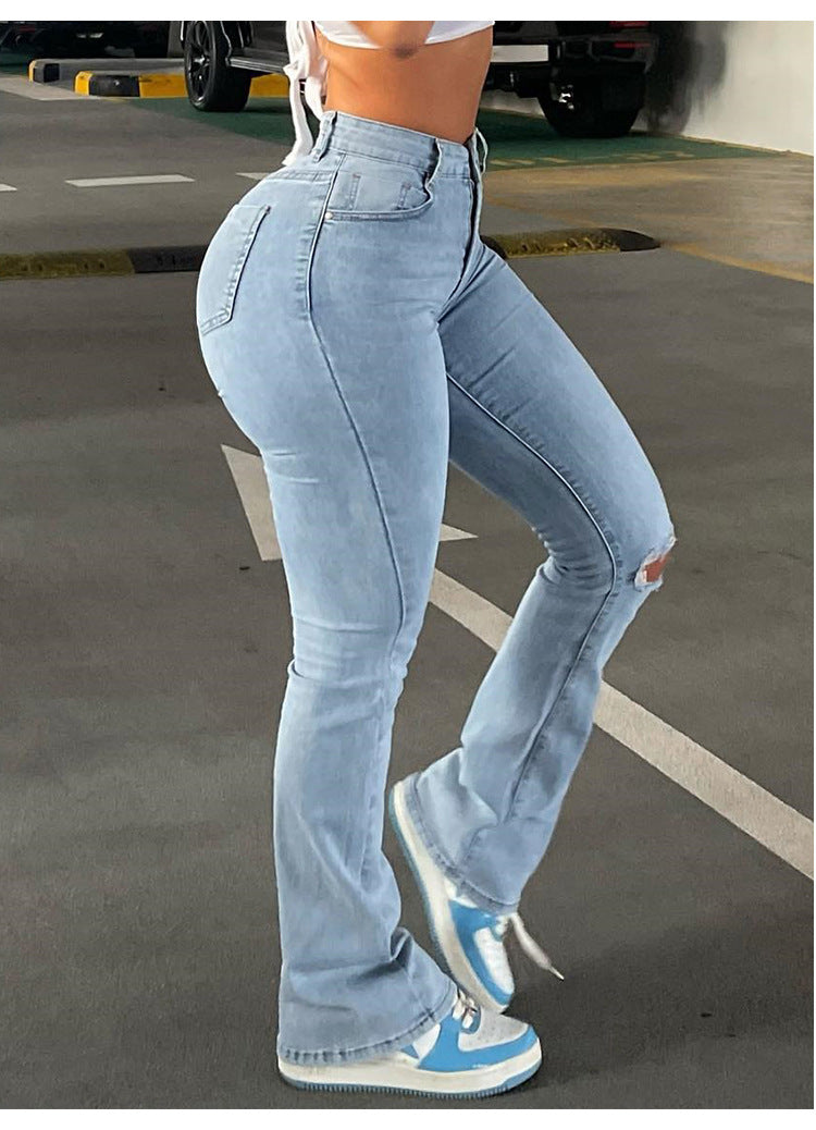 Calça lápis jeans rasgada de cintura alta da moda